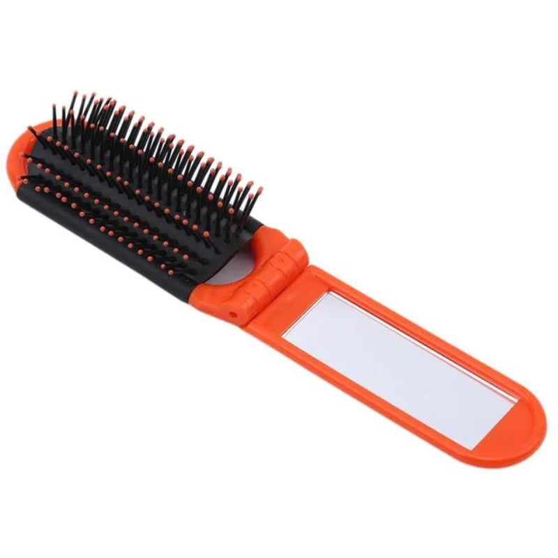 Brosse munie d’un miroir de poche