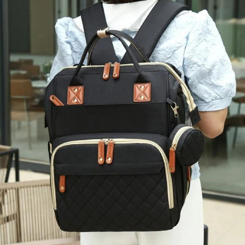 Couchage bébé pliable intégré au sac à langer